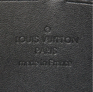 Portafogli Louis Vuitton Zippy in tela monogram cerata color crema con motivo